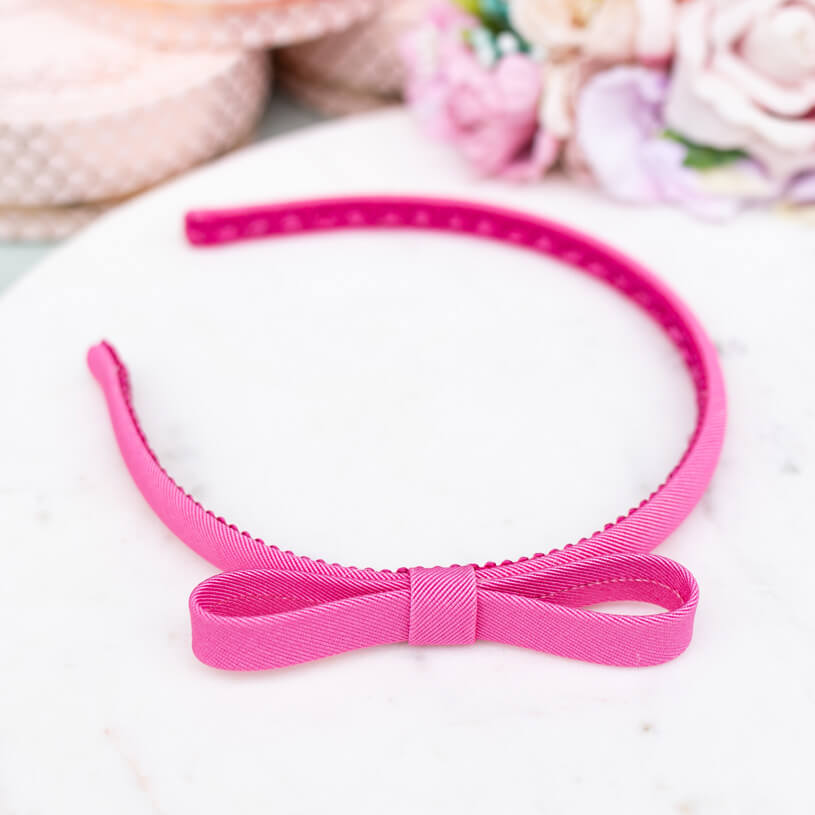 Schmaler pinker Satin-Haarreif mit Schleife