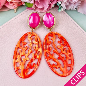 Pinkfarbene Ohrringe als Clips mit orangem Oval in Korallenoptik