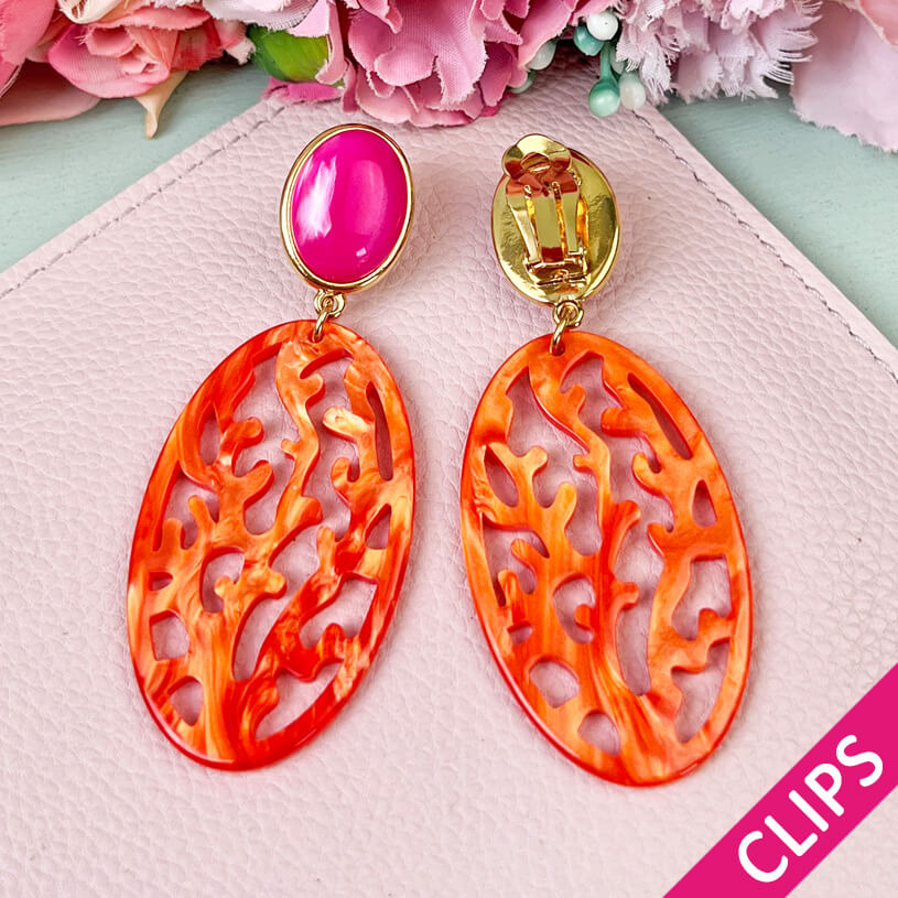 Pinkfarbene Ohrringe als Clips mit orangem Oval in Korallenoptik