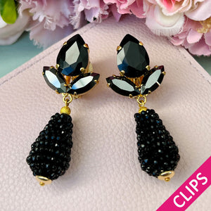 Funkelnde Ohrclips in Schwarz mit glitzernden Tropfen von AmuseToi