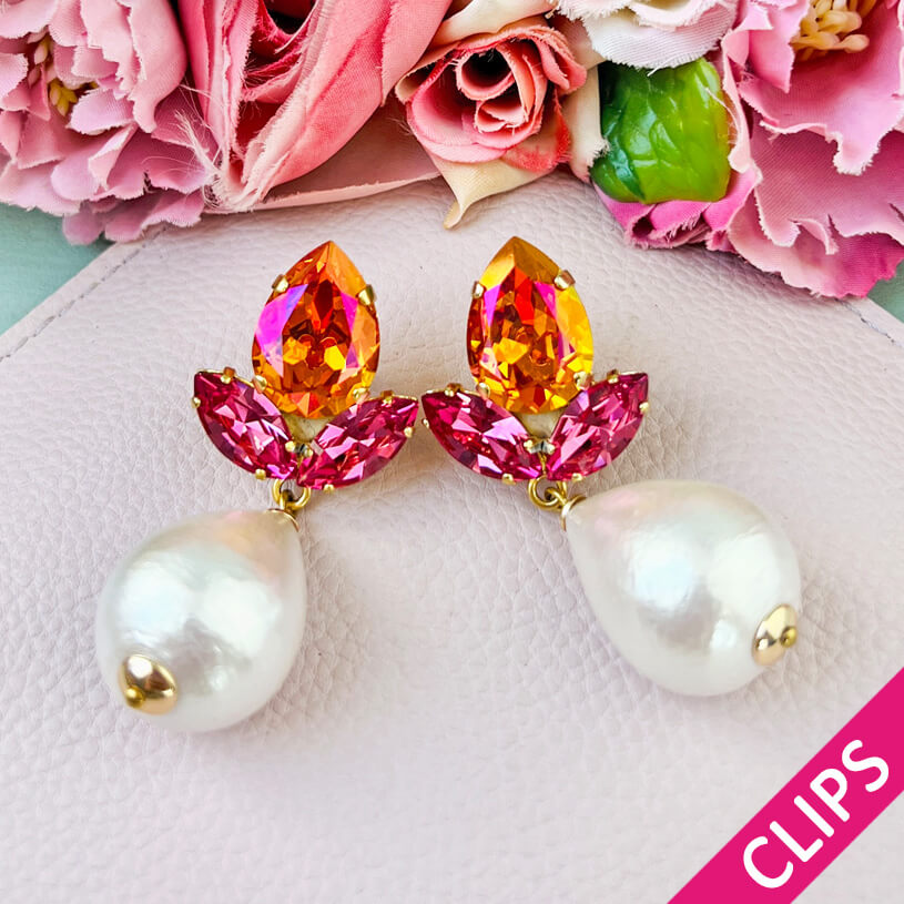 Funkelnde Ohrclips in Pink und Orange mit federleichten Baumwolltropfen