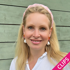 Funkelnde Ohrclips in Pink und Orange mit federleichten Baumwolltropfen