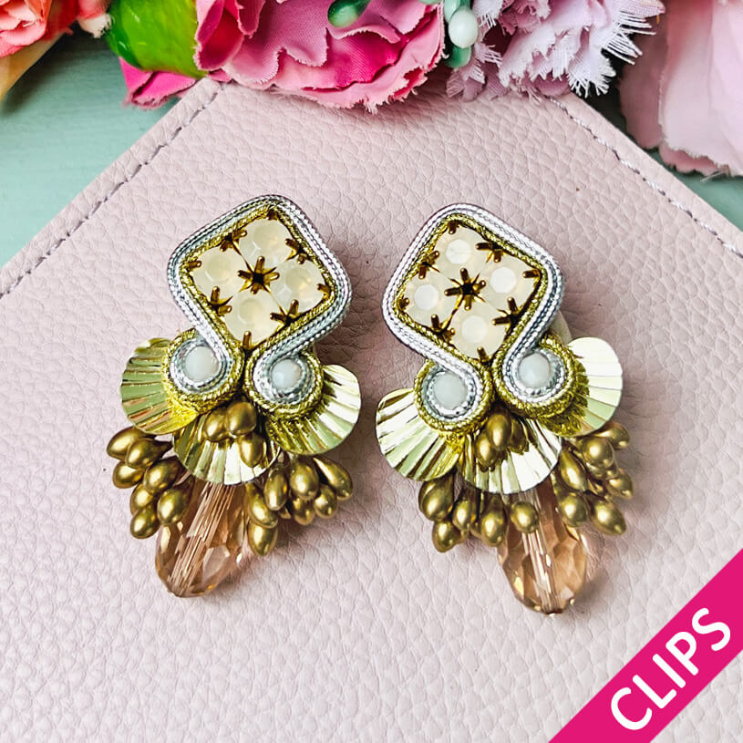 Gold und Silber glänzende Statement-Ohrclips mit Glitzer-Tropfen