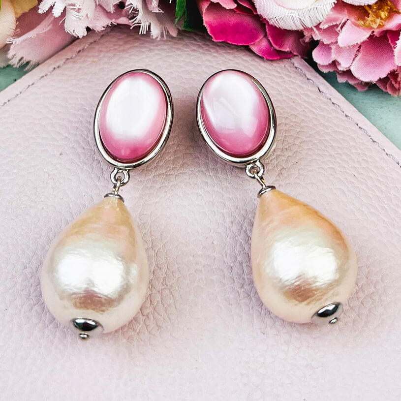 Silberne Ohrstecker in Rosa mit federleichten Baumwolltropfen