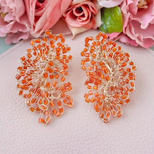 Edle Perlen-Ohrringe aus mehreren Blüten in Orange